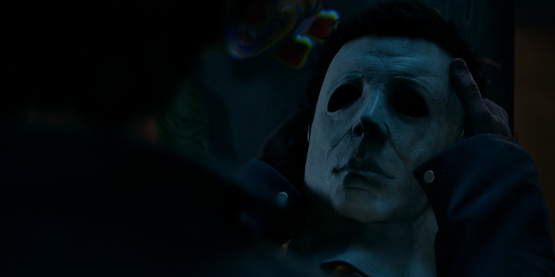 Official Steam screenshot from Halloween: The Game showing Michael Myers in a dark Haddonfield scene.