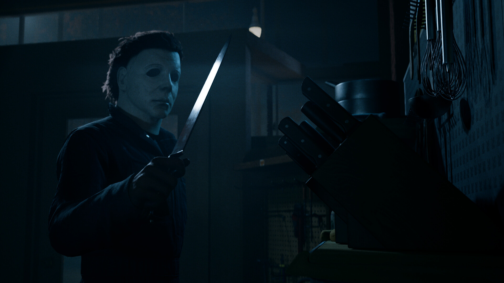 Official Steam screenshot from Halloween: The Game showing a tense nighttime gameplay scene in Haddonfield.